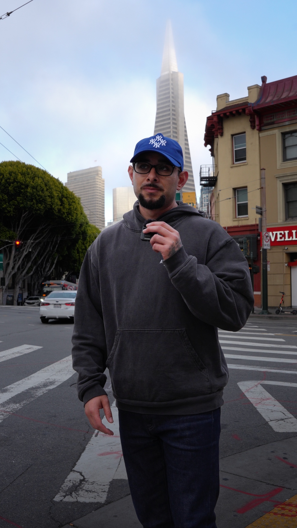 Miguel Cerda Jr. on-camera in San Francisco with the Transamerica Pyramid in the background